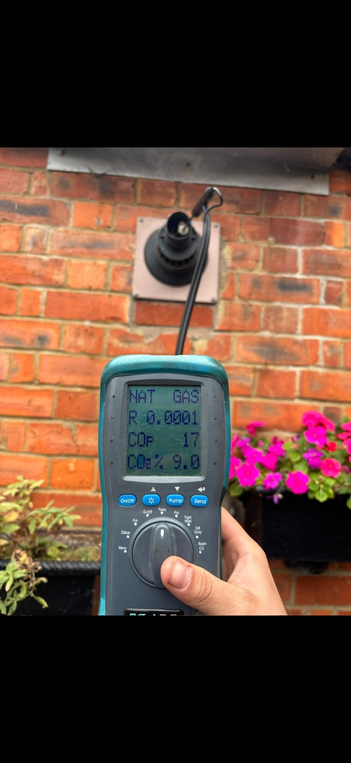 Flue gas analyser being used during a boiler check